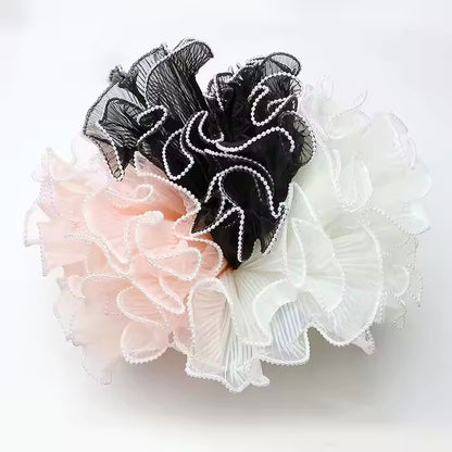 Maille à volants ondulée avec bord nacré