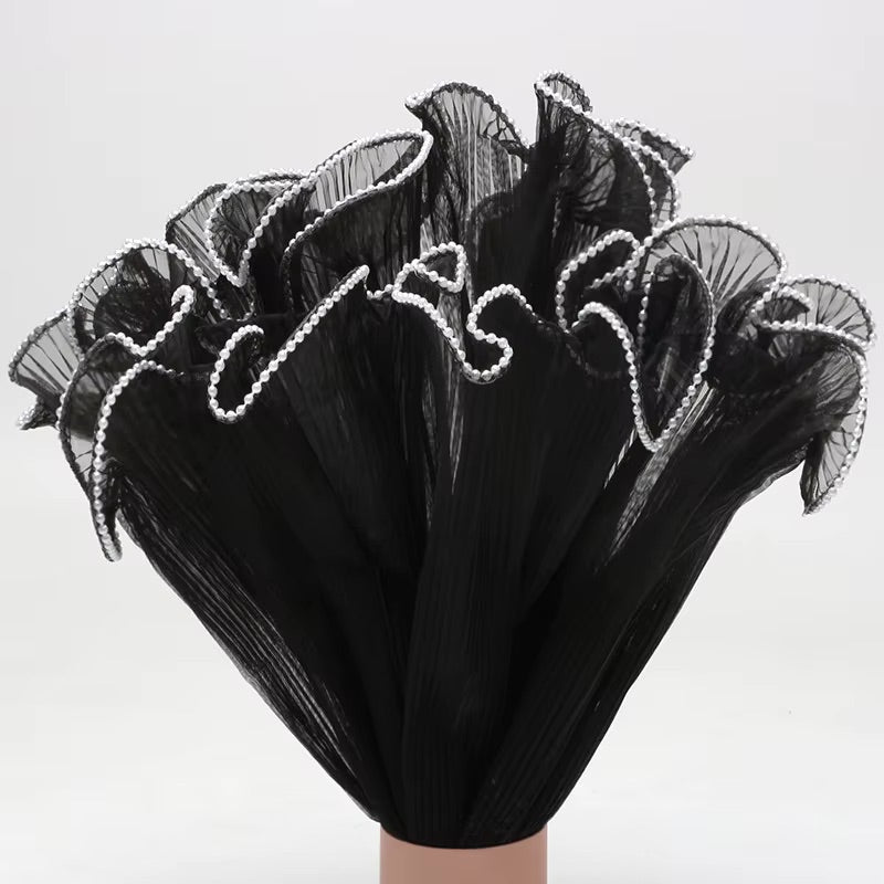 Maille à volants ondulée avec bord nacré